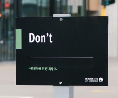 3 official looking signs in Christchurch simply telling residents Don't